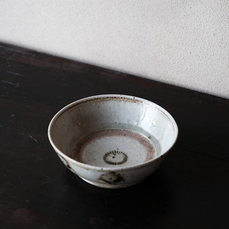 Quinam Ash Glazed Bowl with Stamped Solar-whorl Design in Underglaze Iron, Vietnam, 17th century