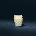 A yellow <b>jade</b> <b>carving</b> of a head, Shijiahe Culture, circa 2500-2000 BC