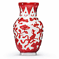 A carved <b>red</b>-<b>overlay</b> <b>white</b> <b>glass</b> vase, Qing dynasty, 19th century
