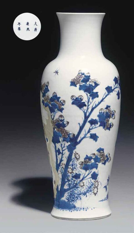 A copper-red and celadon-decorated blue and white carved baluster vase, Kangxi six-character mark in underglaze blue within a double circle and of the period (1662-1722)