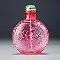 A ruby-pink glass 'lotus and fish' snuff bottle. Imperial glassworks, Beijing, 1730-<b>1780</b>