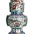 A fine and rare Ming wucai '<b>dragon</b>' <b>zun</b>-shaped vase, China, Wanli six-character mark within double circles and of the period 