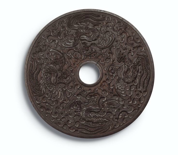 A circular zitan panel, Qing dynasty, Qianlong period