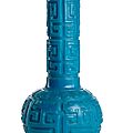 A deep cut <b>turquoise</b>-<b>blue</b> Beijing glass bottle vase with dragon decoration, engraved Qianlong four-character mark, 18th-19th ct