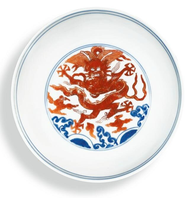 An iron-red and underglaze-blue ‘dragon’ dish, Mark and period of Wanli (1573-1619)