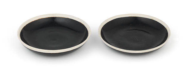 A pair of Cizhou-type white-rimmed and black glazed dishes, 12th-13th century