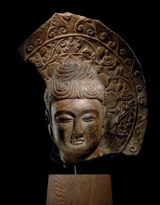 A_rare_dark_grey_stone_head_of_Buddha__Tang_dynasty__618_907_
