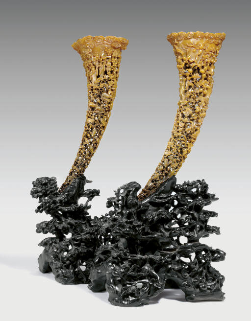 A pair of large reticulated rhinoceros horn libation cups, 19th century