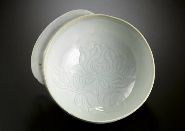 A rare 'qingbai' 'Peony' handled cup, Song dynasty (960-1127)