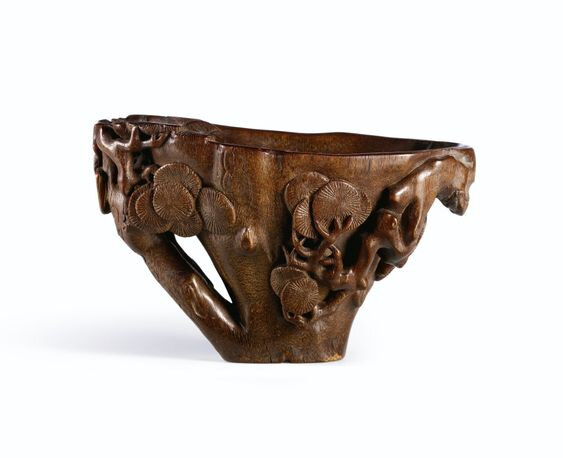 A rhinoceros horn 'pine cluster' libation cup, Qing dynasty, 17th-18th century