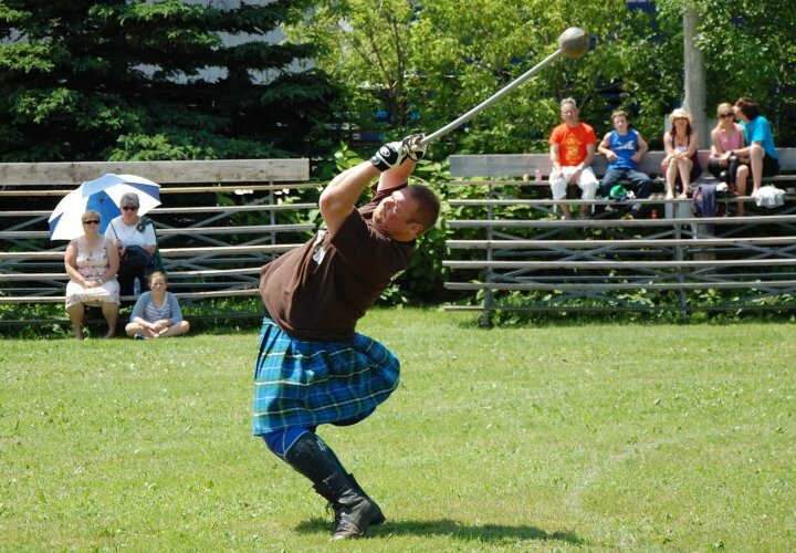 heavyweight_danny_frame_demonstrates_the_art_of_throwing_the_hammer_during_an_exhibition_of_the_heavyweight_games_at_the_college_of_piping_s_summerside_highland_gathering