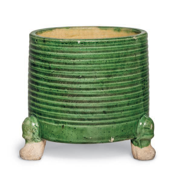 A small green and yellow-glazed cylindrical tripod censer, Tang dynasty (AD 618-907)