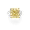 A 14.57 carats <b>cut</b>-<b>cornered</b> modified <b>rectangular</b>-<b>cut</b> fancy yellow <b>diamond</b> ring
