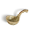 A green-glazed pottery ladle, <b>Han</b> <b>dynasty</b> (206 BC-220 AD)