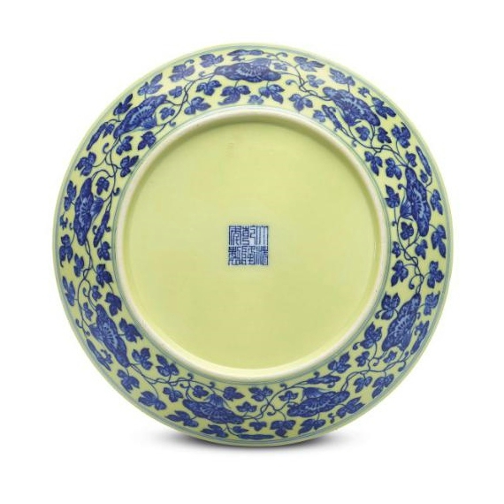 A blue and white 'Nine Peaches' dish, Qianlong six-character seal mark in underglaze blue and of the period (1736-1795)
