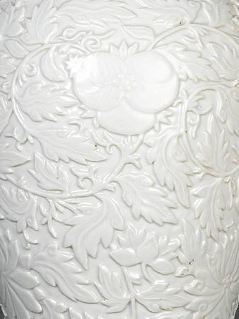 A_rare_white_glazed_relief_decorated_vase_and_cover3