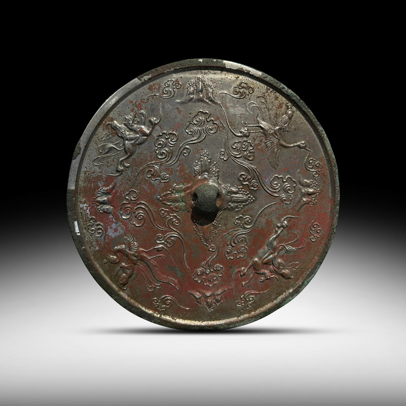 A bronze 'Immortals' mirror, Tang Dynasty (618-907)