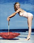 1949_tobey_beach_by_dedienes_umbrella_red_060_3