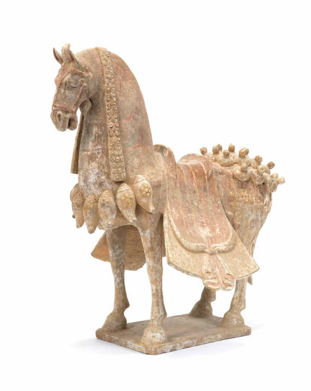 A painted pottery model of a caparisoned horse, Eastern Wei Dynasty (534-550)