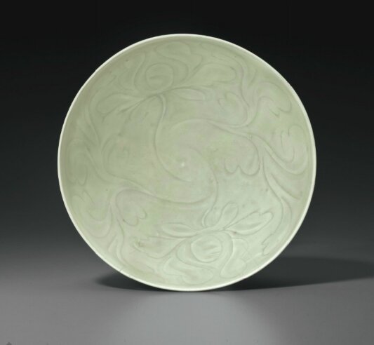 A rare large Longquan celadon carved bowl, China, Southern Song Dynasty (1127-1279)