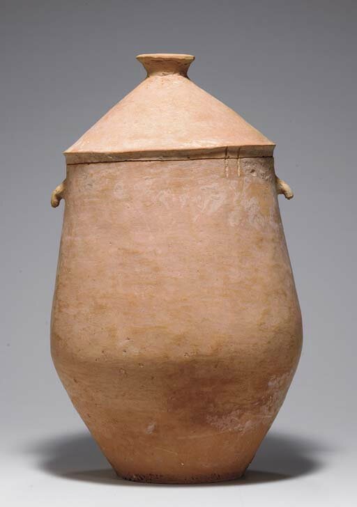 A rare large red pottery jar and cover, Neolithic period, probably Qijia culture, circa 2050-1700 BC