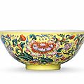 An exceptionally rare Imperial <b>famille</b> <b>rose</b> <b>yellow</b>-<b>ground</b> 'floral' bowl Qianlong six-character mark and of the period