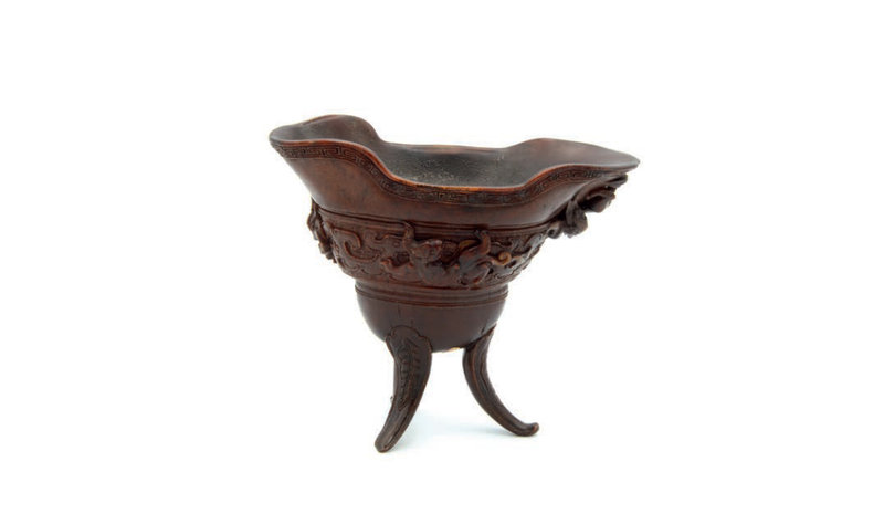 A rare Chinese rhinoceros horn archaistic libation cup, jue, Qing dynasty, 17th century