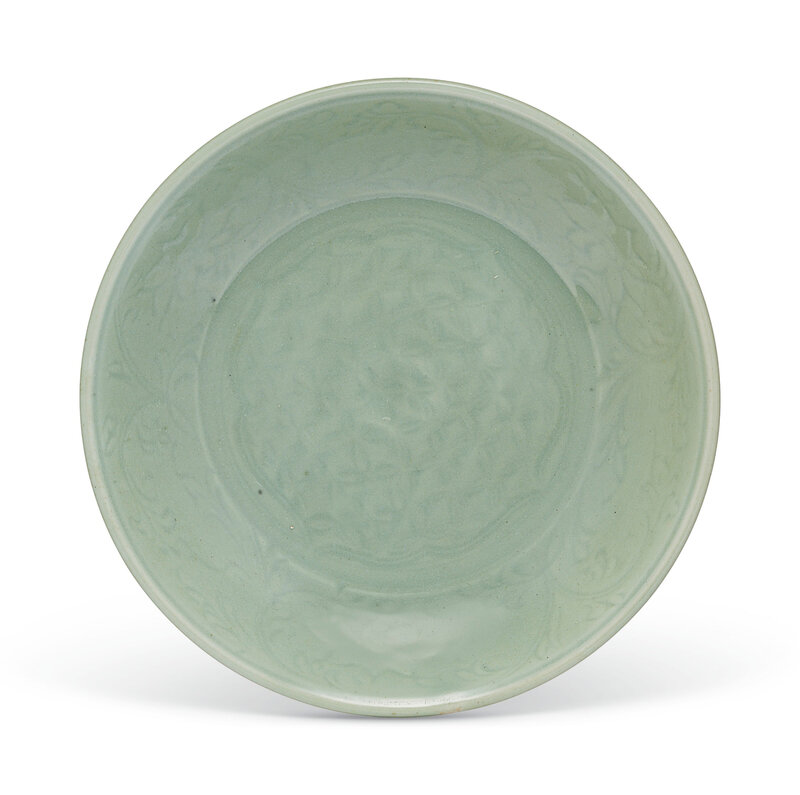 A carved Longquan celadon dish, Ming dynasty (1368-1644)