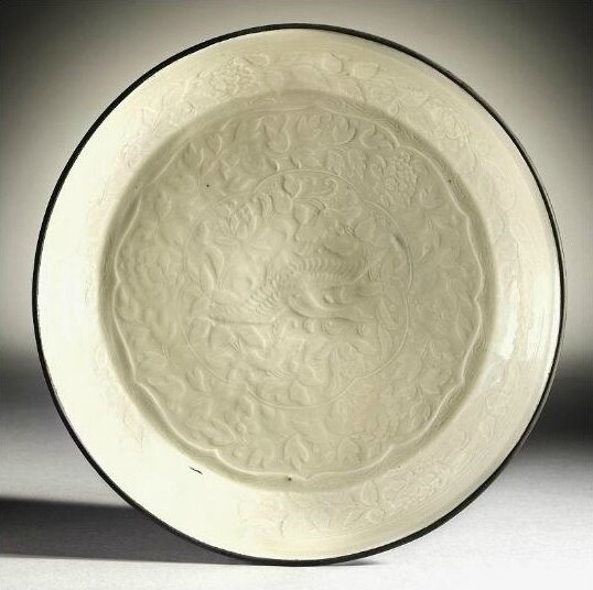 A fine and rare molded 'Ding' dish, Northern Song - Jin dynasty