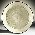 A fine and rare <b>molded</b> 'Ding' <b>dish</b>, Northern Song-Jin dynasty (960-1134)