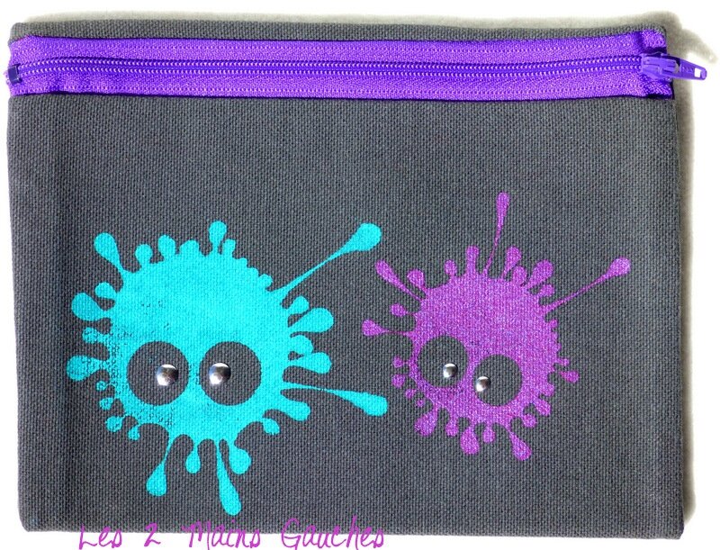 trousse peinte avec taches monstres violette et turquoise