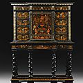 A pewter, brass, fruitwood and stained sycamore inlaid marquetry, ebony and ebonised cabinet on stand attributed to <b>Pierre</b> <b>Gole</b> 