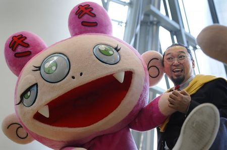 562102_japanese_artist_murakami_poses_with_a_giant_puppet_version_of_kiki_at_the_opening_of_his_exhibition_copyright_murakami_at_the_guggenheim_museum_in_bilbao