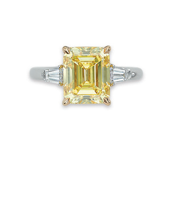 A colored diamond and diamond ring