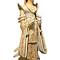 A painted pottery standing figure <b>of</b> a court lady, Tang dynasty, 7th - early 8th century